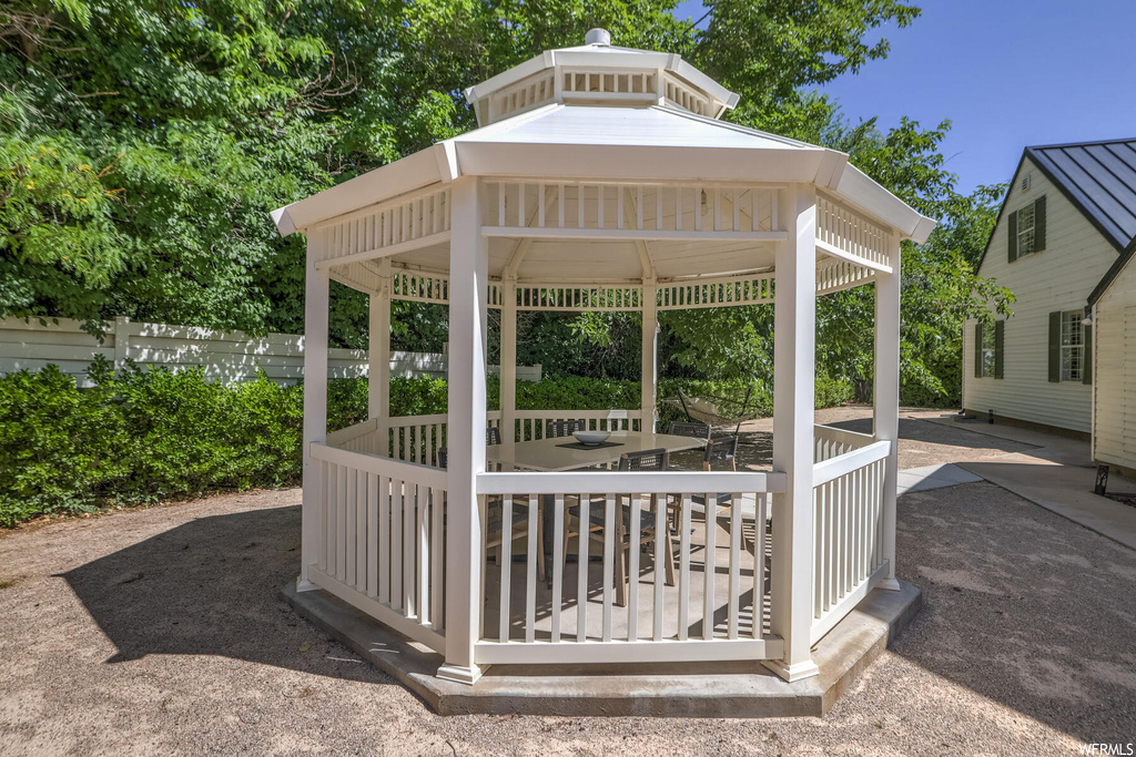 Exterior space with a gazebo and wooden deck
