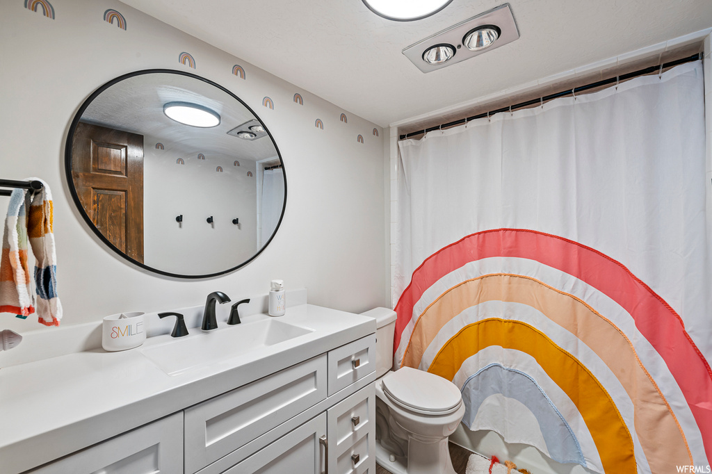 Bathroom featuring mirror and vanity