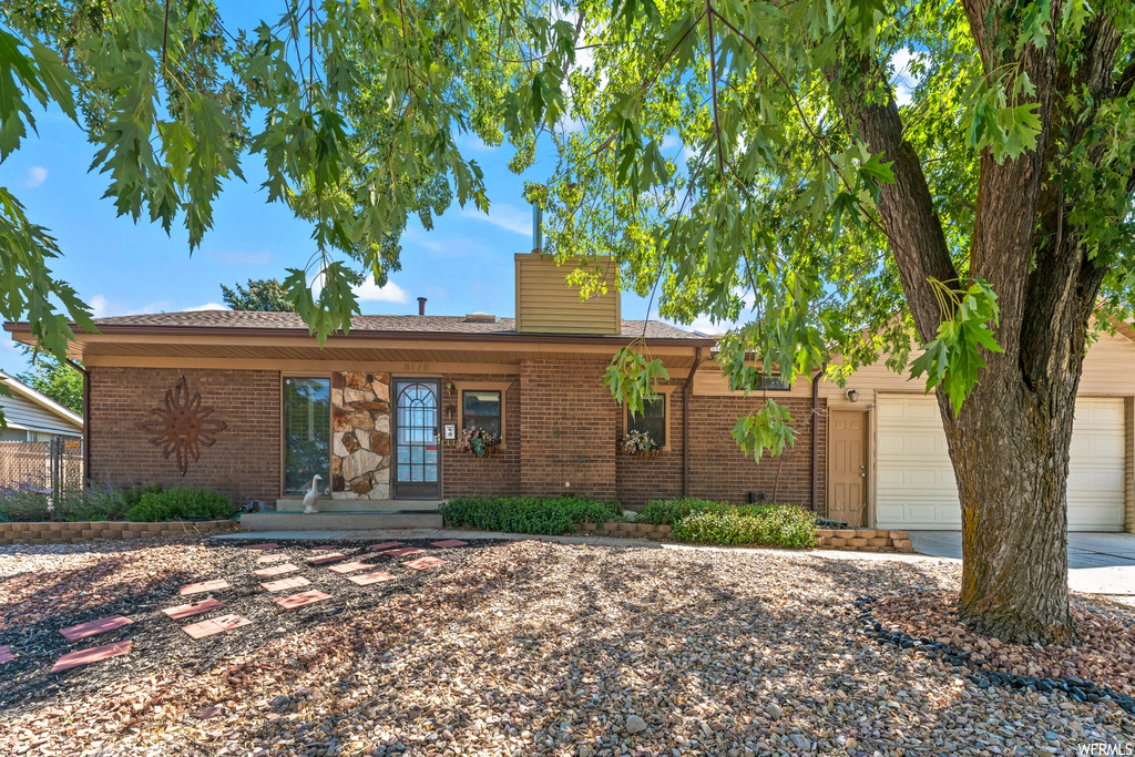 Ranch-style home featuring a garage