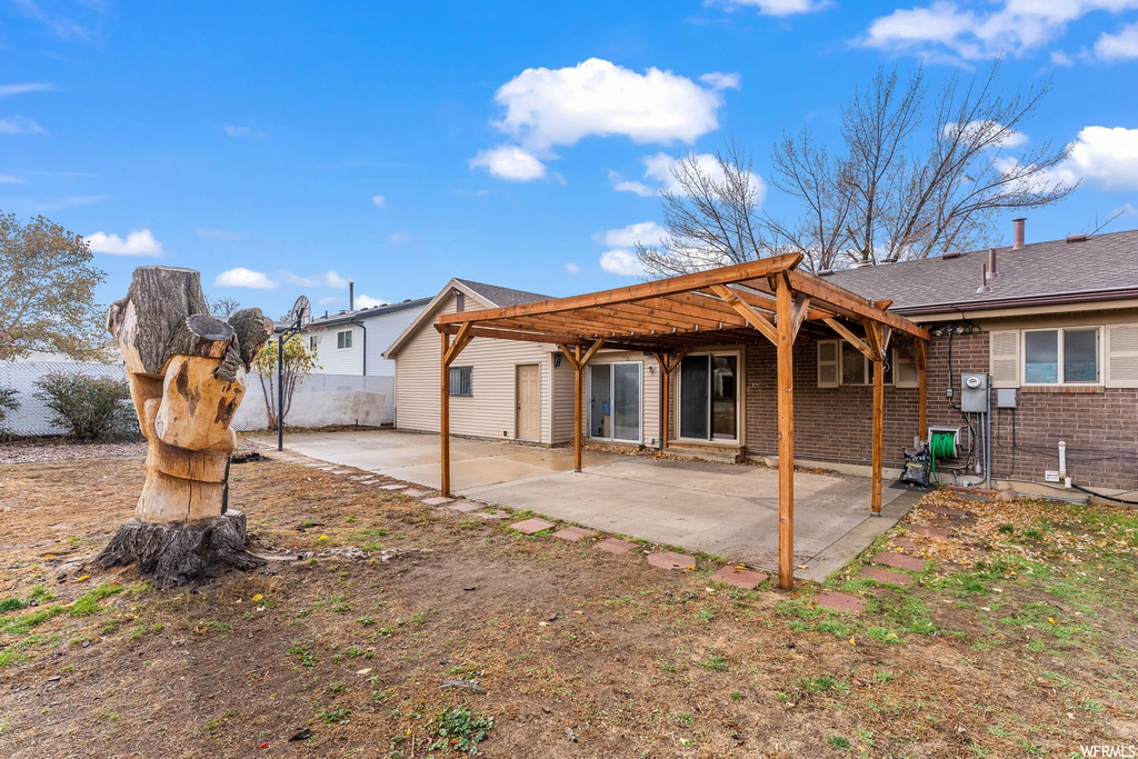 Rear view of house featuring a patio area