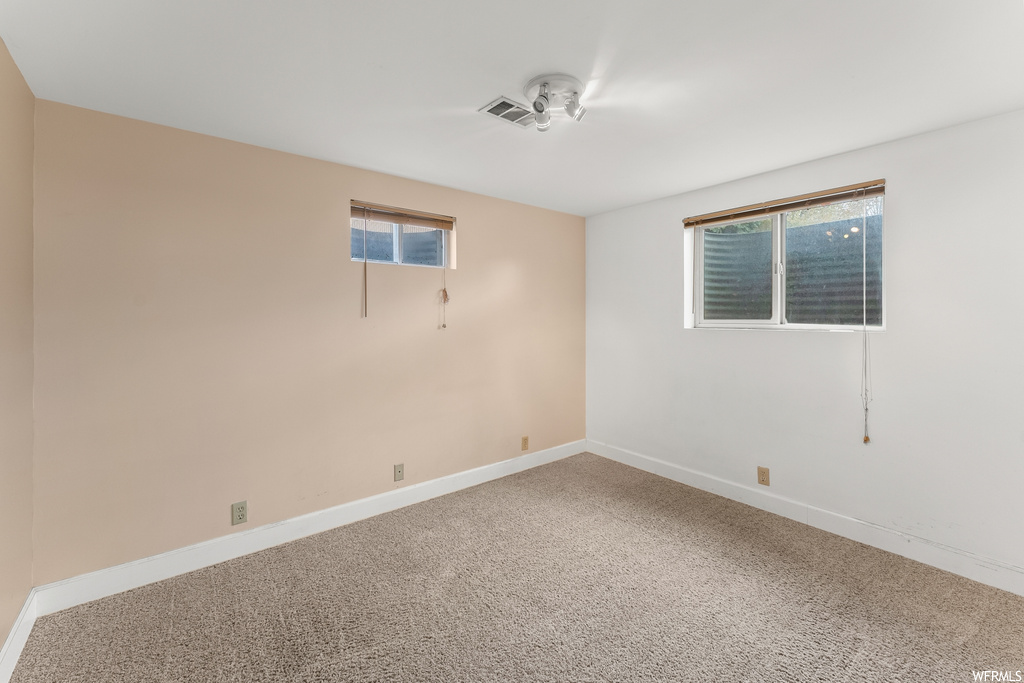 View of carpeted spare room