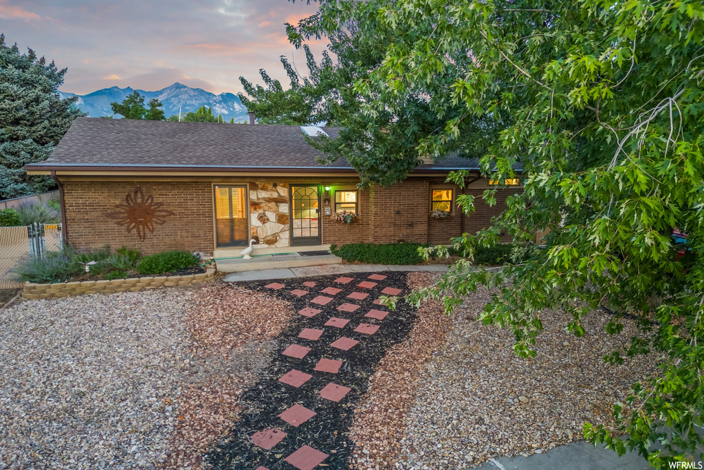 View of front of home with a patio