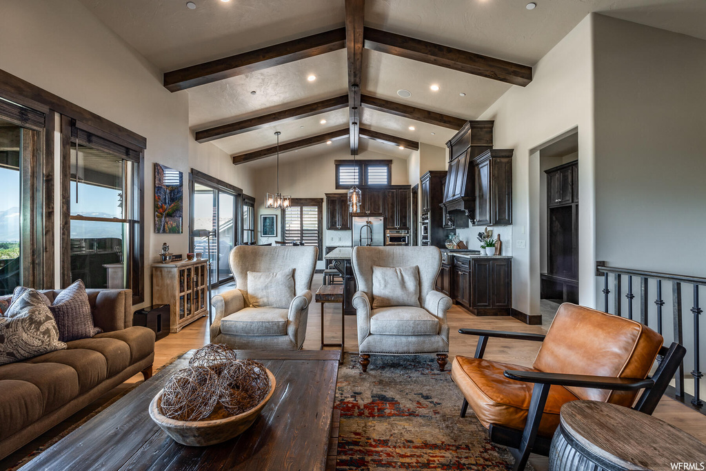 Living room featuring a high ceiling, dark parquet floors, and lofted ceiling with beams