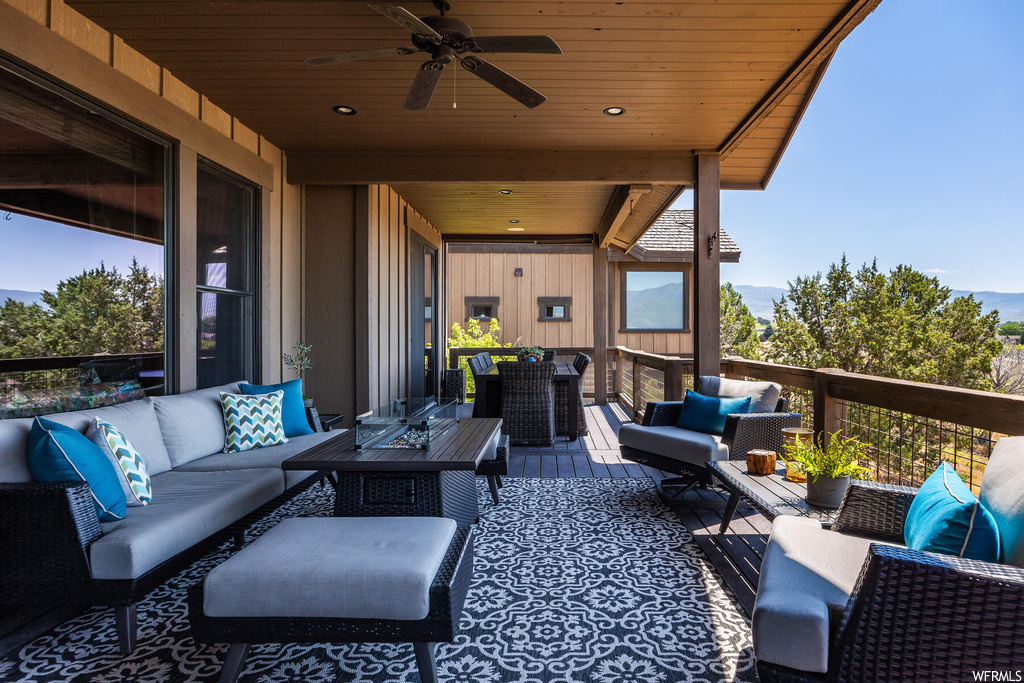 View of patio / terrace featuring ceiling fan and an outdoor living space