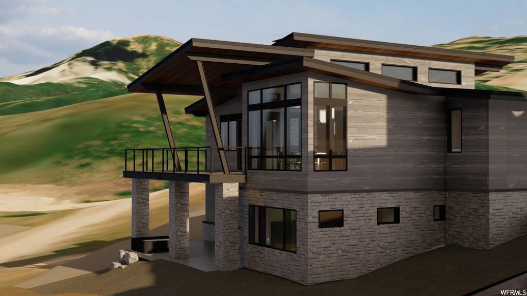 View of side of property featuring balcony and a mountain view
