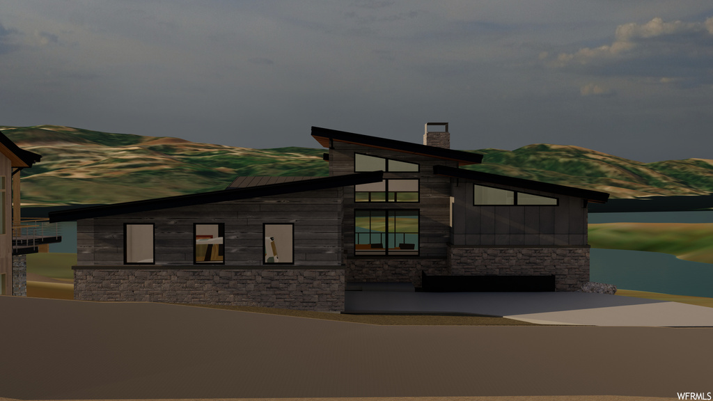 View of front of home featuring a mountain view