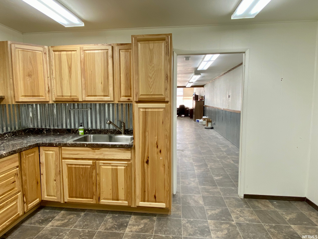 Kitchen with dark tile floors