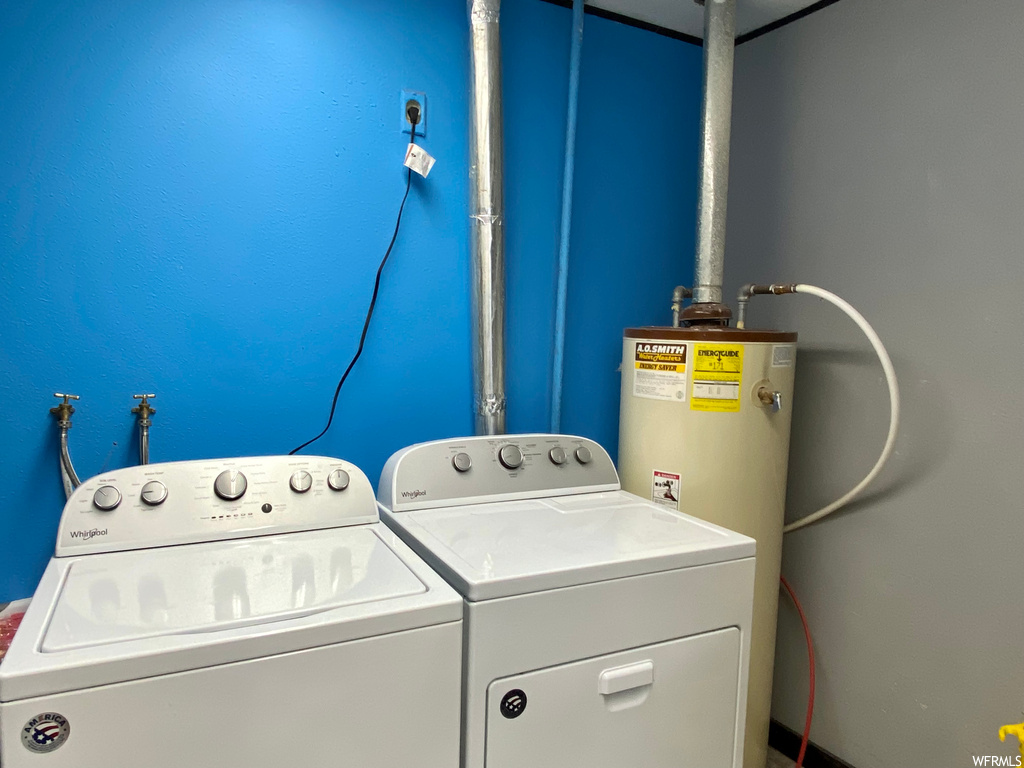 Clothes washing area with independent washer and dryer and water heater