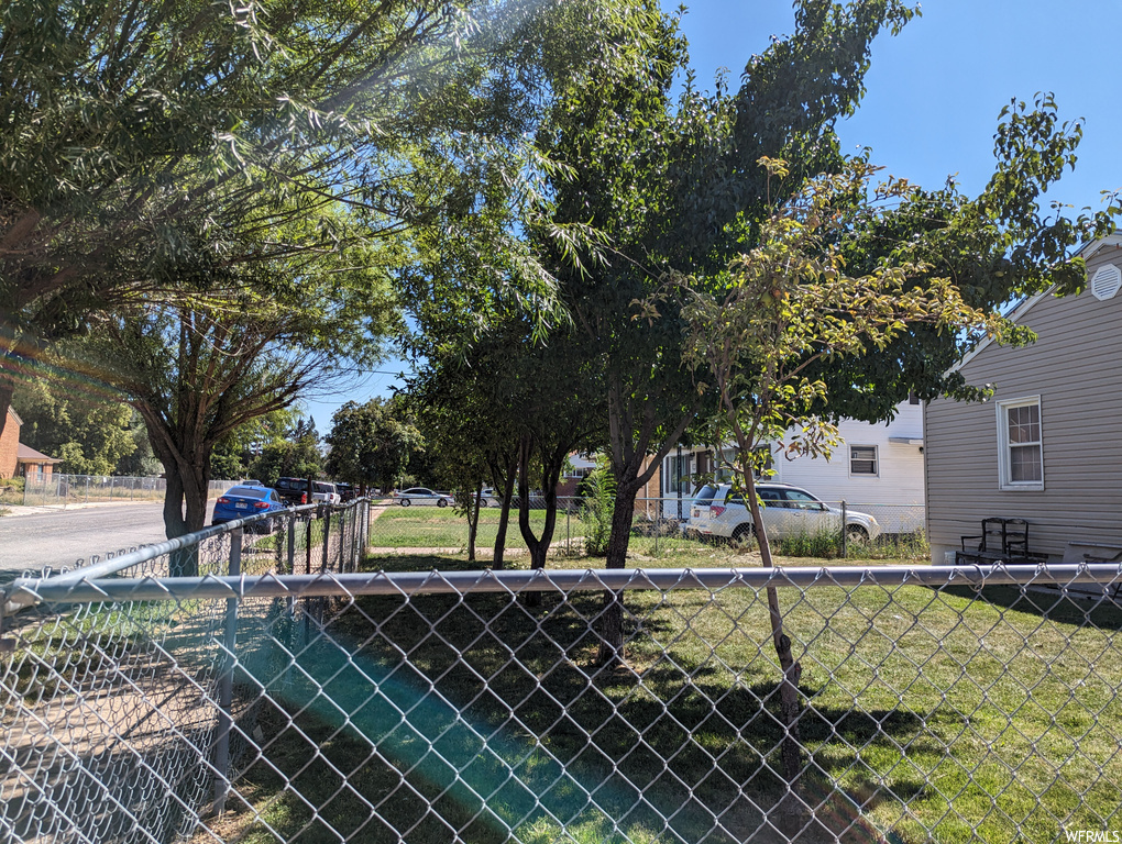 Exterior space featuring a yard