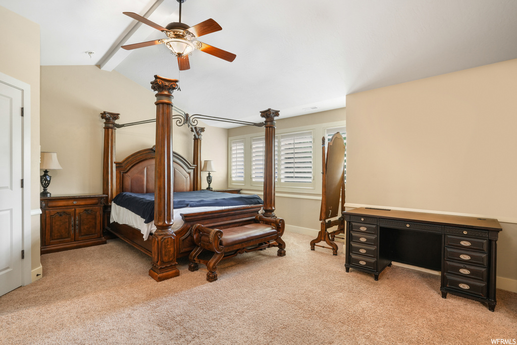 Bedroom with light carpet, lofted ceiling with beams, and ceiling fan