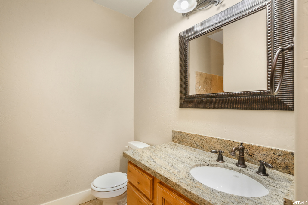 Bathroom featuring vanity and mirror