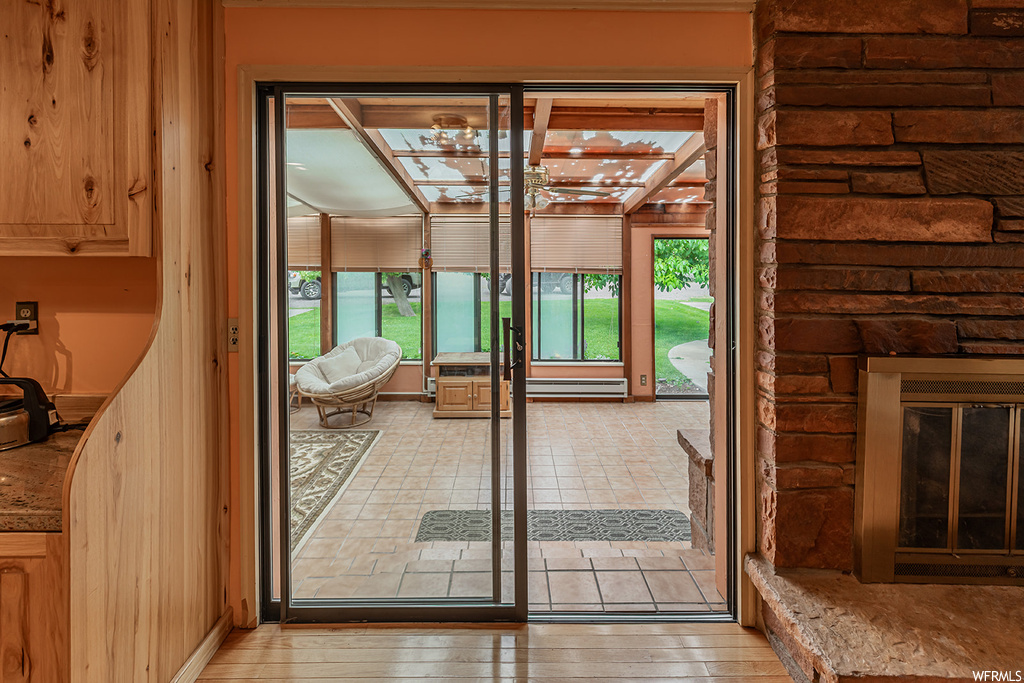 Doorway to outside featuring light hardwood floors