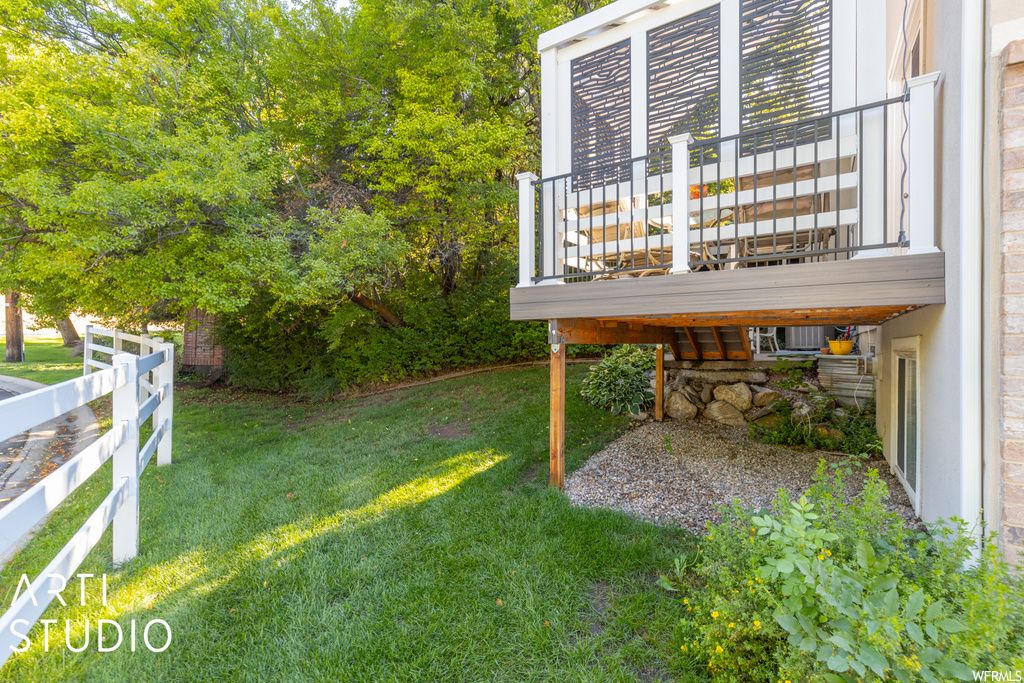 View of yard featuring wooden deck