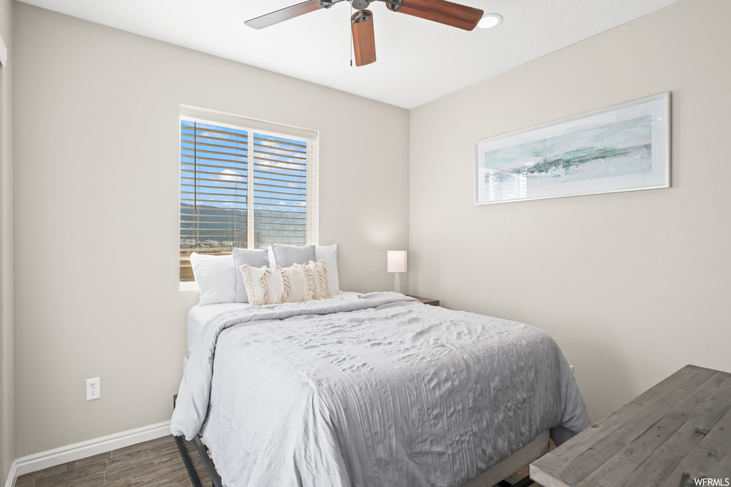 Bedroom featuring ceiling fan and light hardwood floors