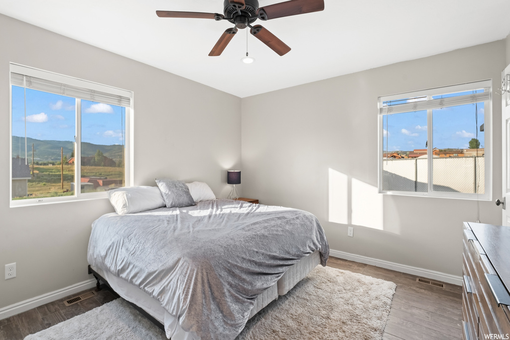 Bedroom featuring ceiling fan and light hardwood flooring