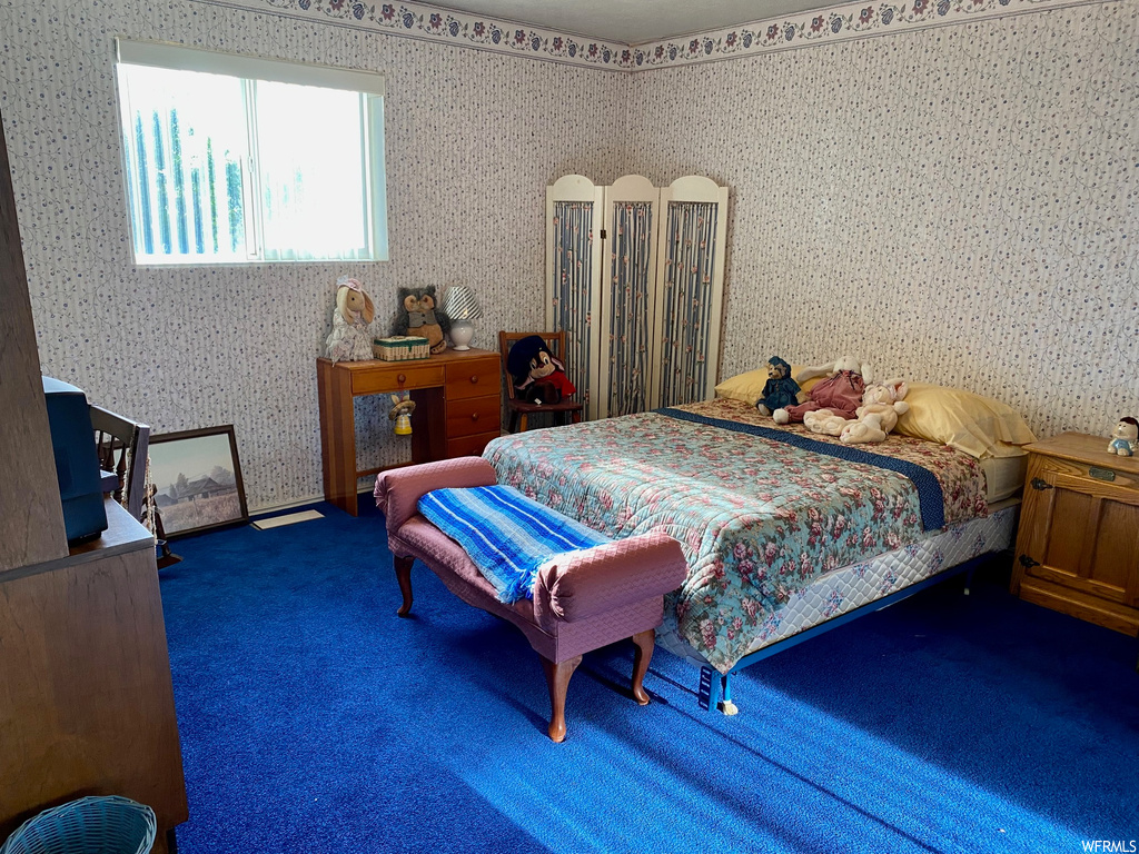 Bedroom with dark carpet