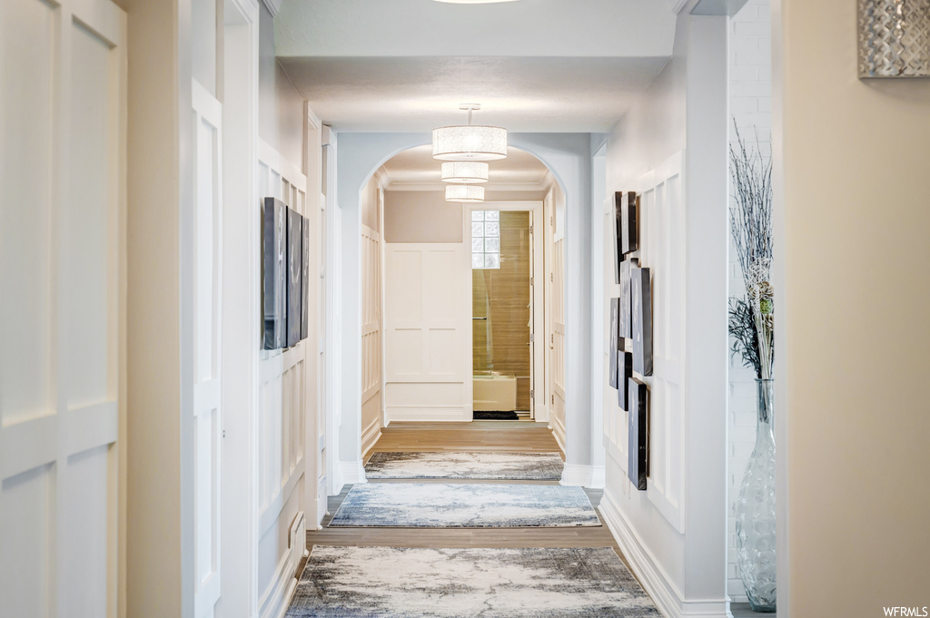 Corridor with light parquet floors