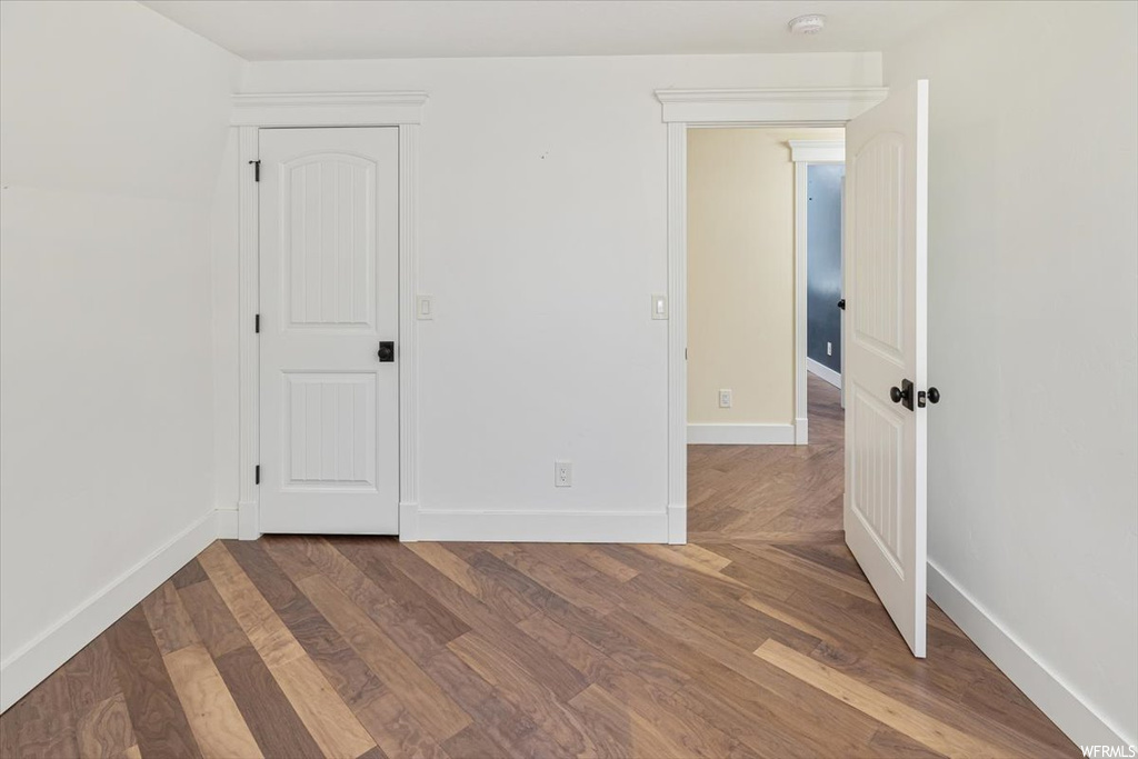 Unfurnished room featuring light hardwood flooring