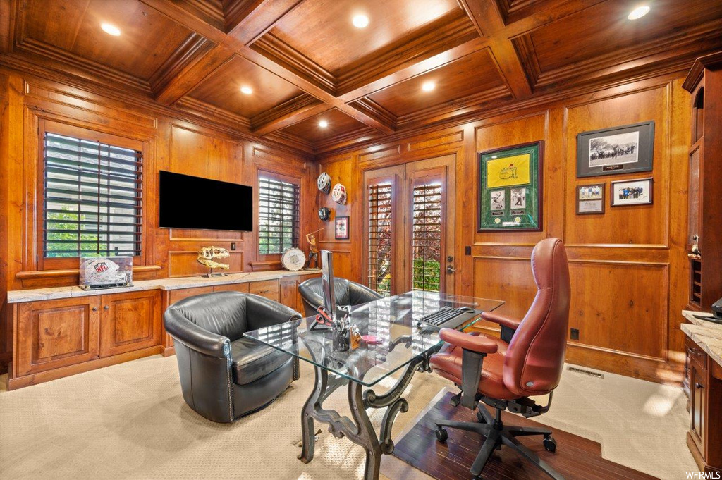 Carpeted office featuring beamed ceiling, crown molding, wooden ceiling, wooden walls, and coffered ceiling