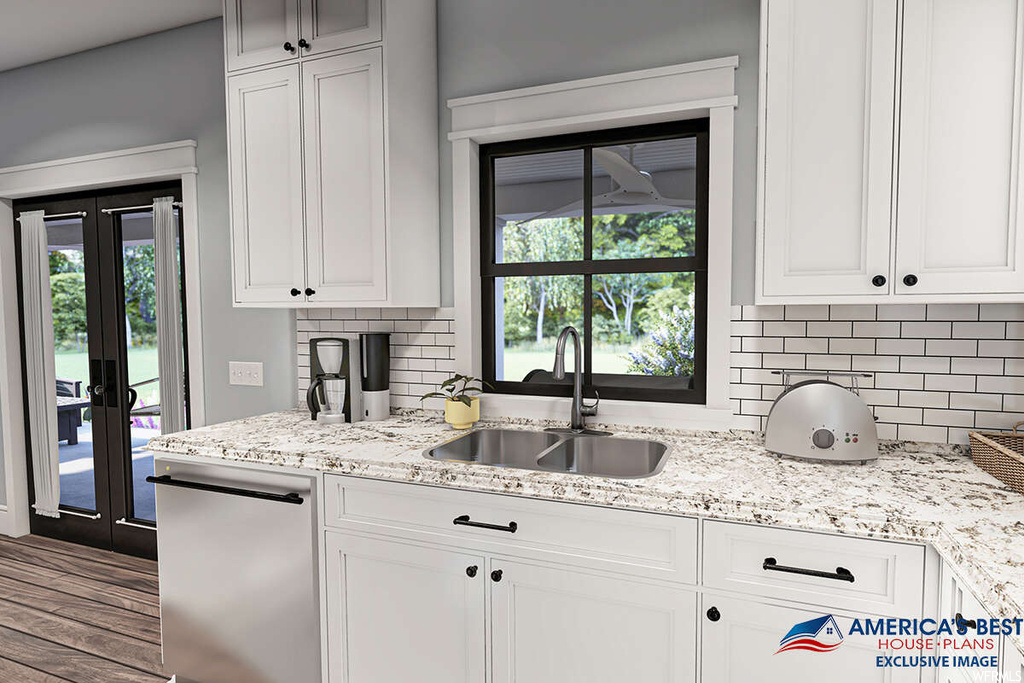 Kitchen featuring backsplash, stainless steel dishwasher, hardwood flooring, french doors, white cabinets, light granite-like countertops, and a healthy amount of sunlight