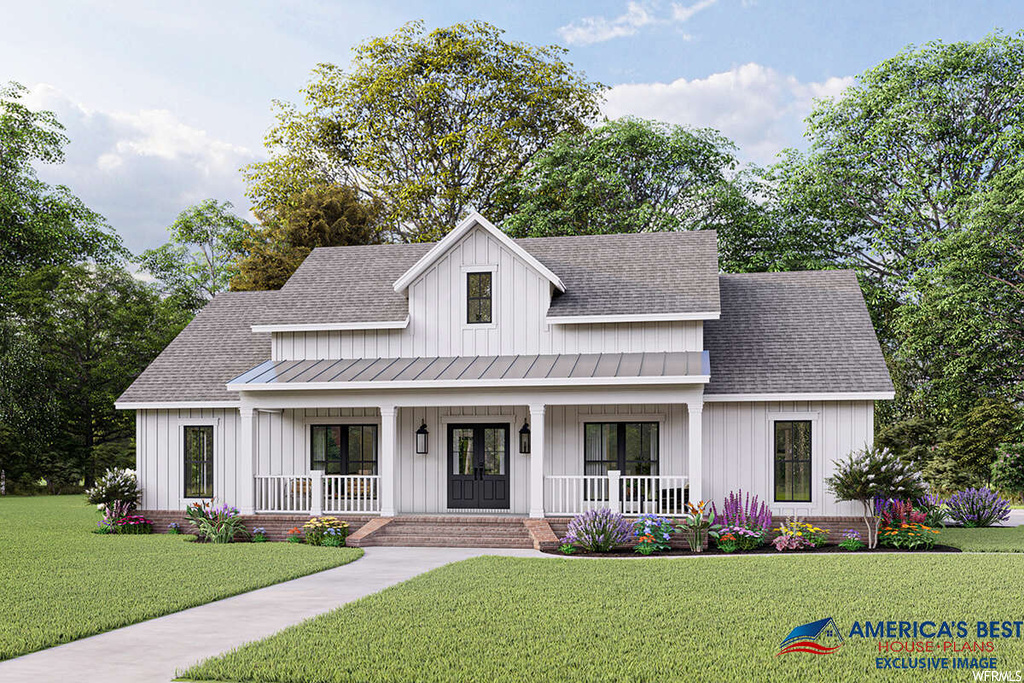 Modern farmhouse style home featuring a front lawn and a porch