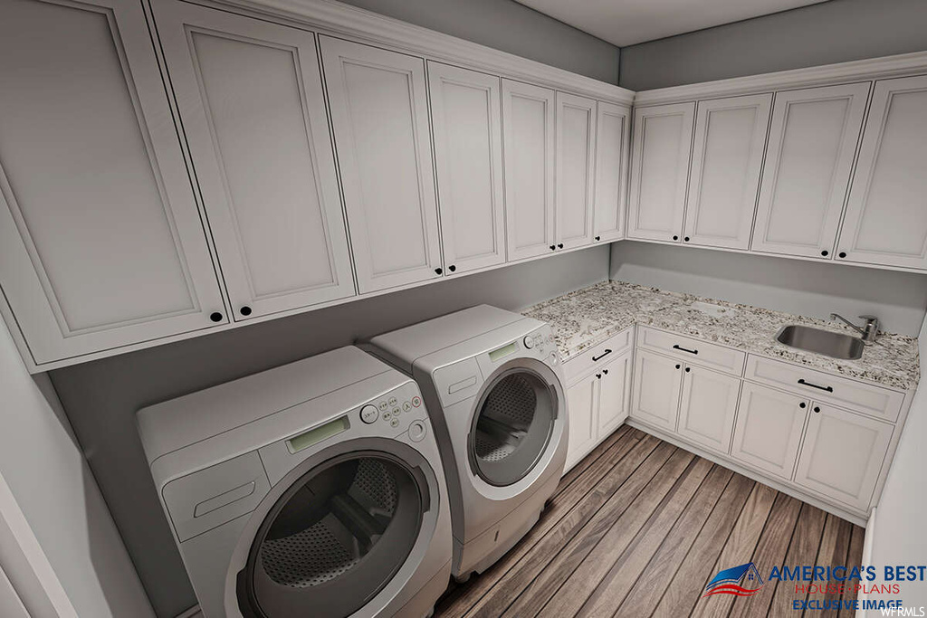 Laundry area with hardwood floors and washer and dryer