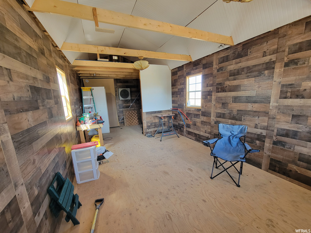 Interior space featuring wood walls