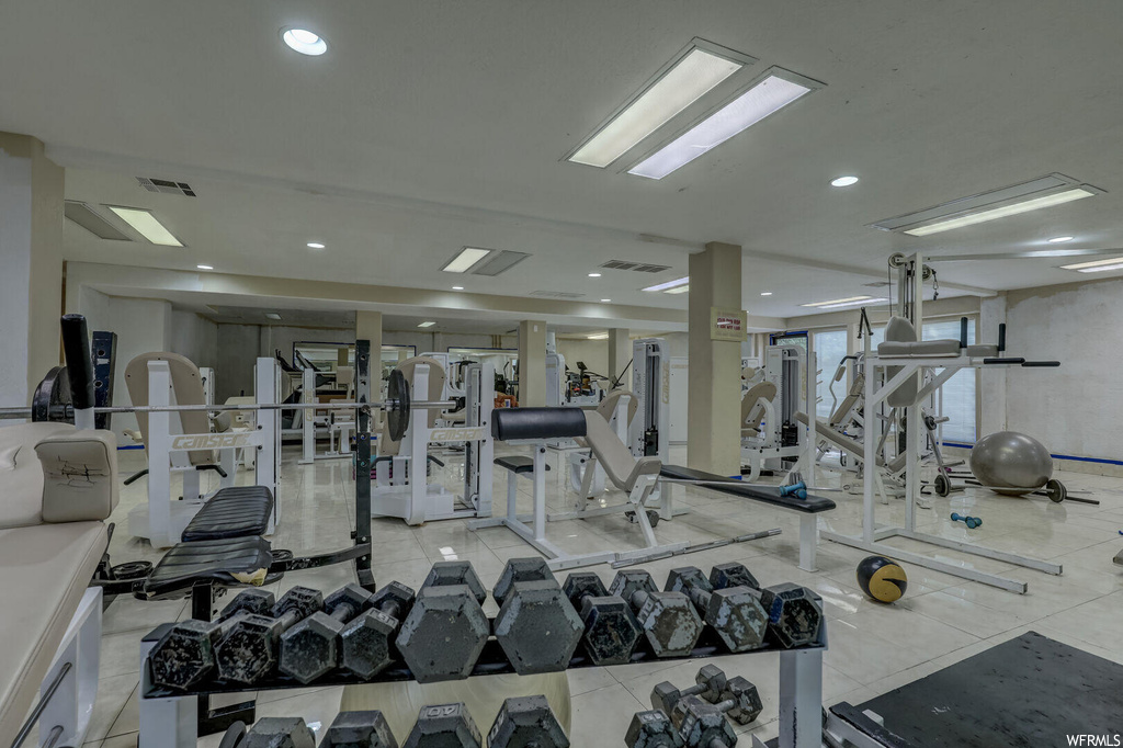 Workout area with light tile floors