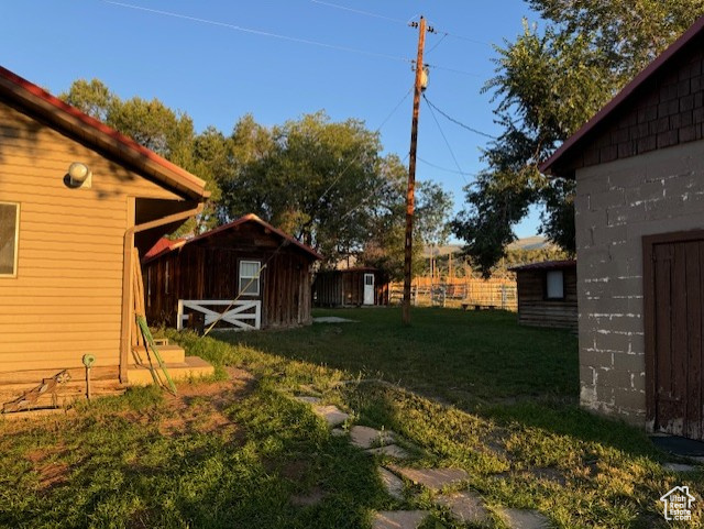 View of yard with a shed