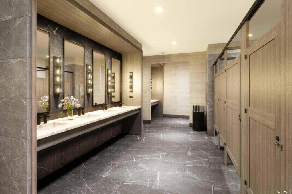 Bathroom with double vanity and tile floors