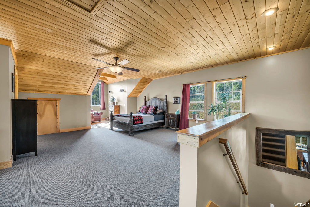 Bedroom with ceiling fan, light carpet, lofted ceiling, and wooden ceiling