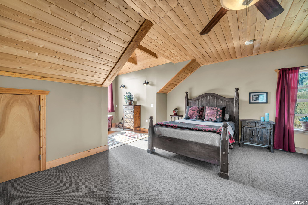 Carpeted bedroom featuring wood ceiling, vaulted ceiling, and ceiling fan