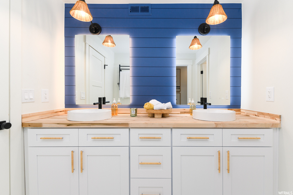 Bathroom with double sink vanity and mirror