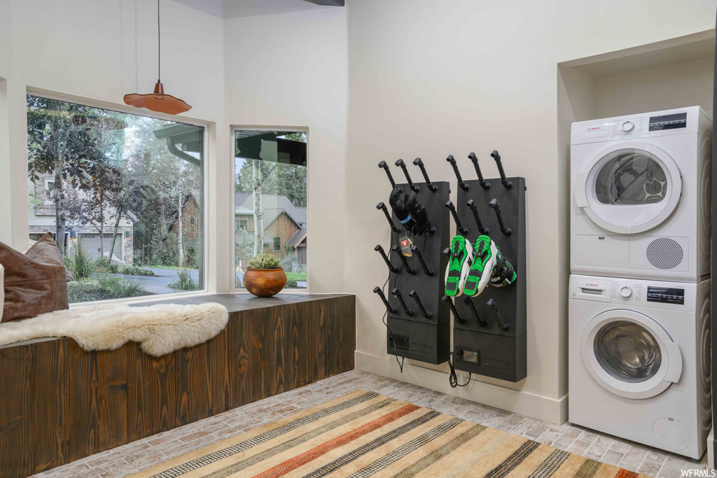 Laundry area featuring stacked washer and dryer