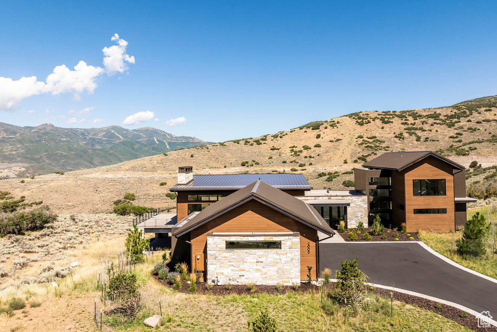 View of front of home featuring a mountain view