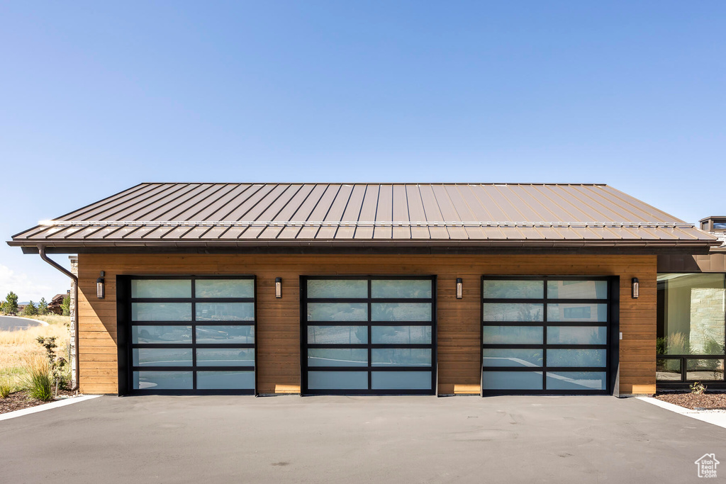 Garage featuring wooden walls