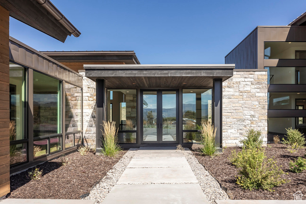 Doorway to property featuring french doors