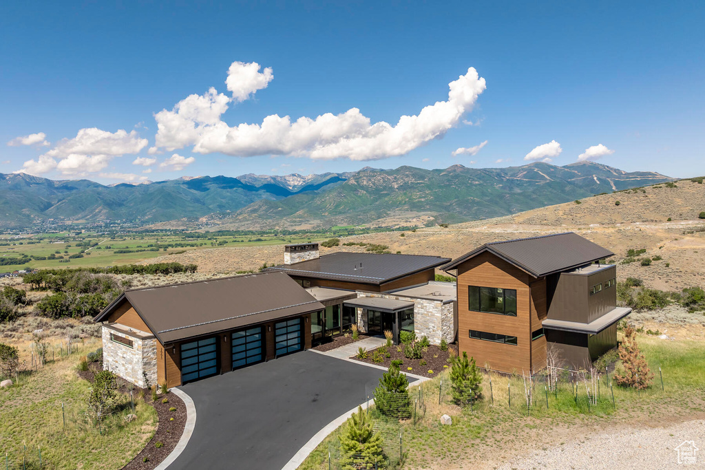 Property view of mountains with a rural view