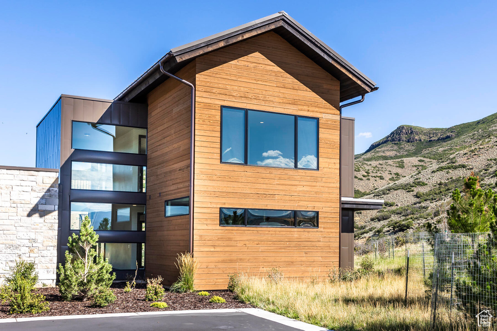 View of property exterior with a mountain view