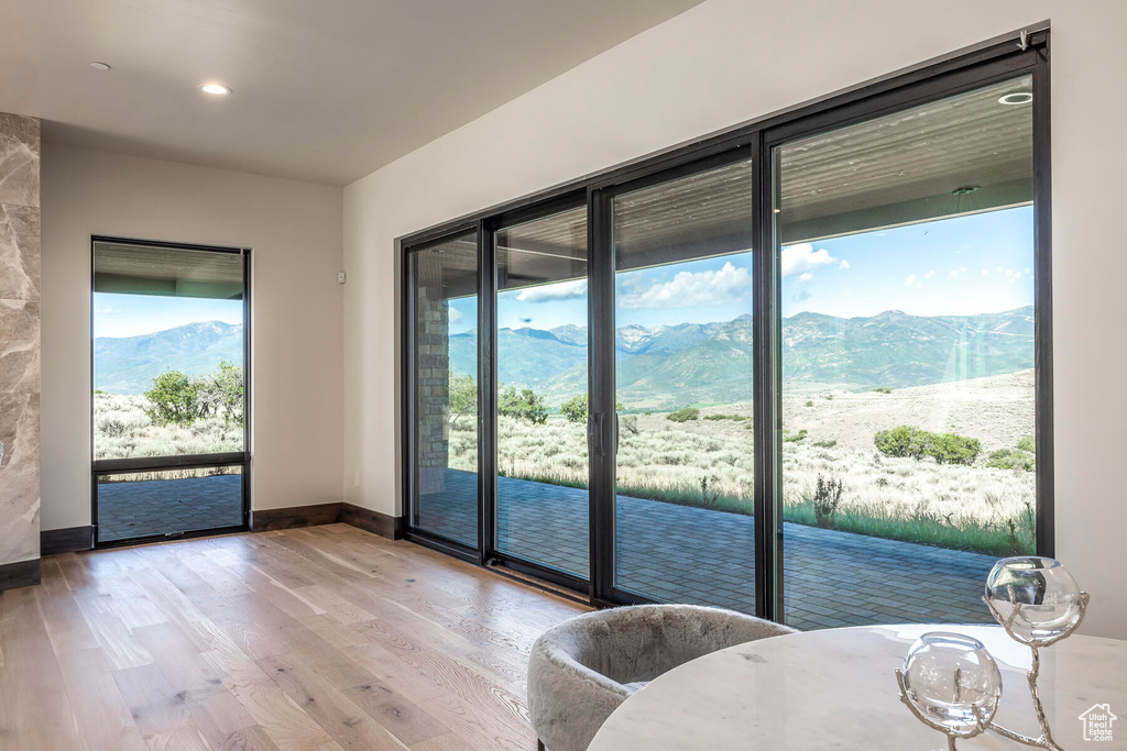 Doorway featuring a mountain view and light hardwood / wood-style floors