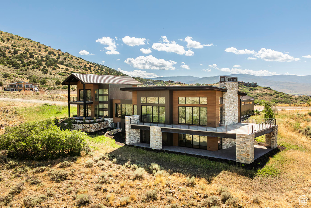 Rear view of house with a mountain view