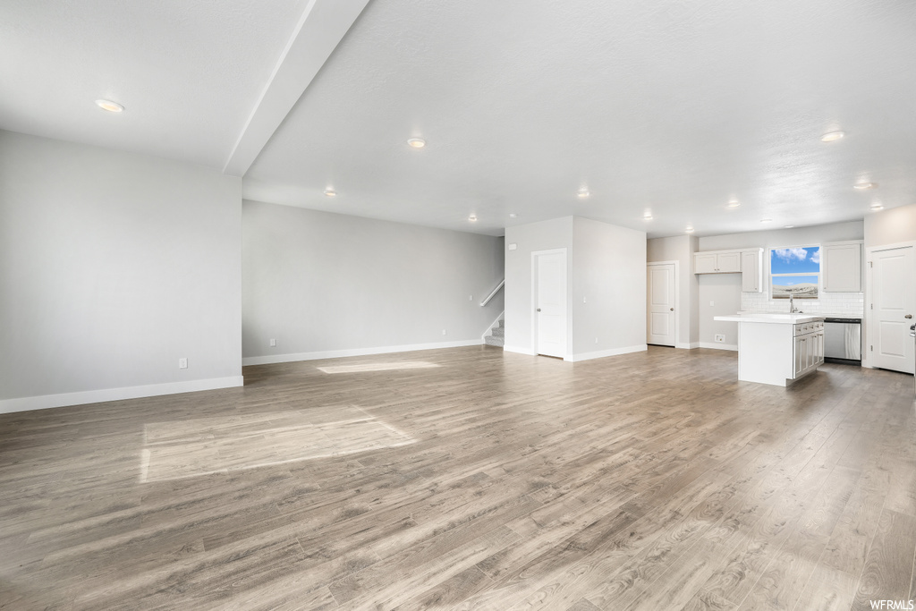 Living room with light hardwood flooring