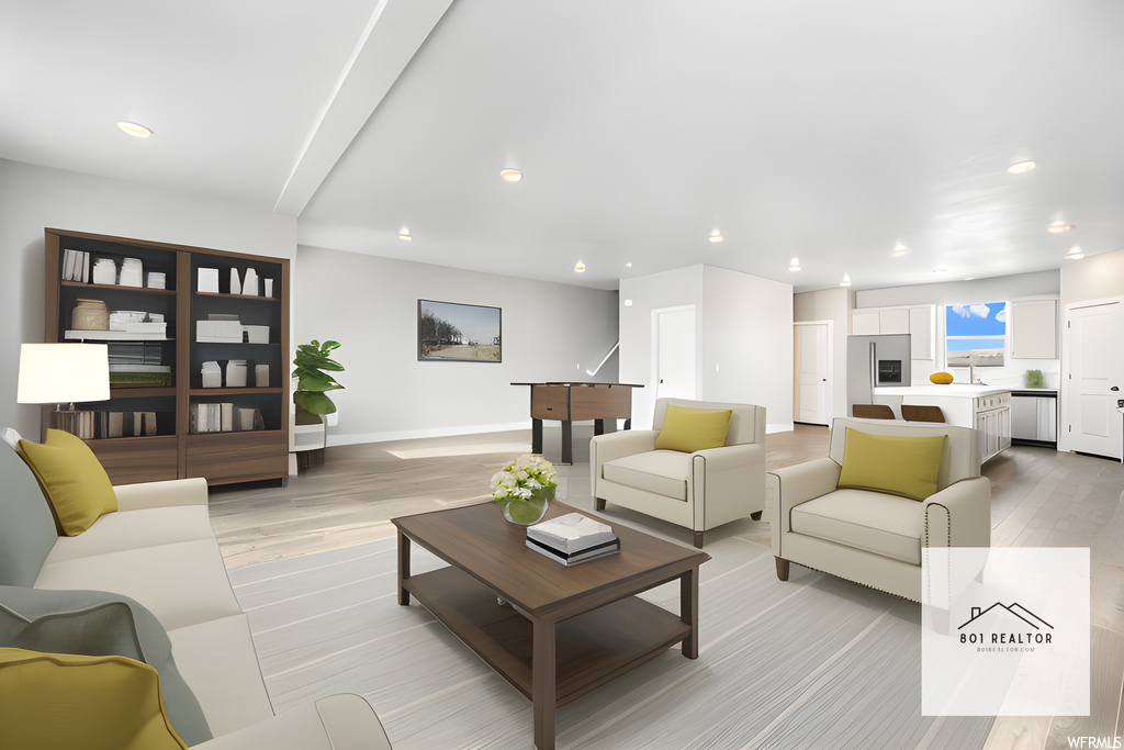 Living room featuring light hardwood flooring