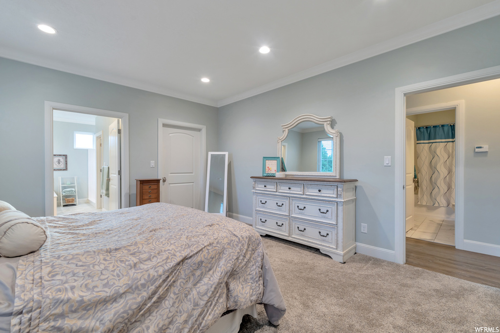 Tiled bedroom featuring crown molding