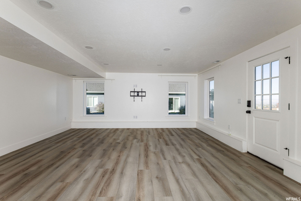 Unfurnished living room with hardwood flooring