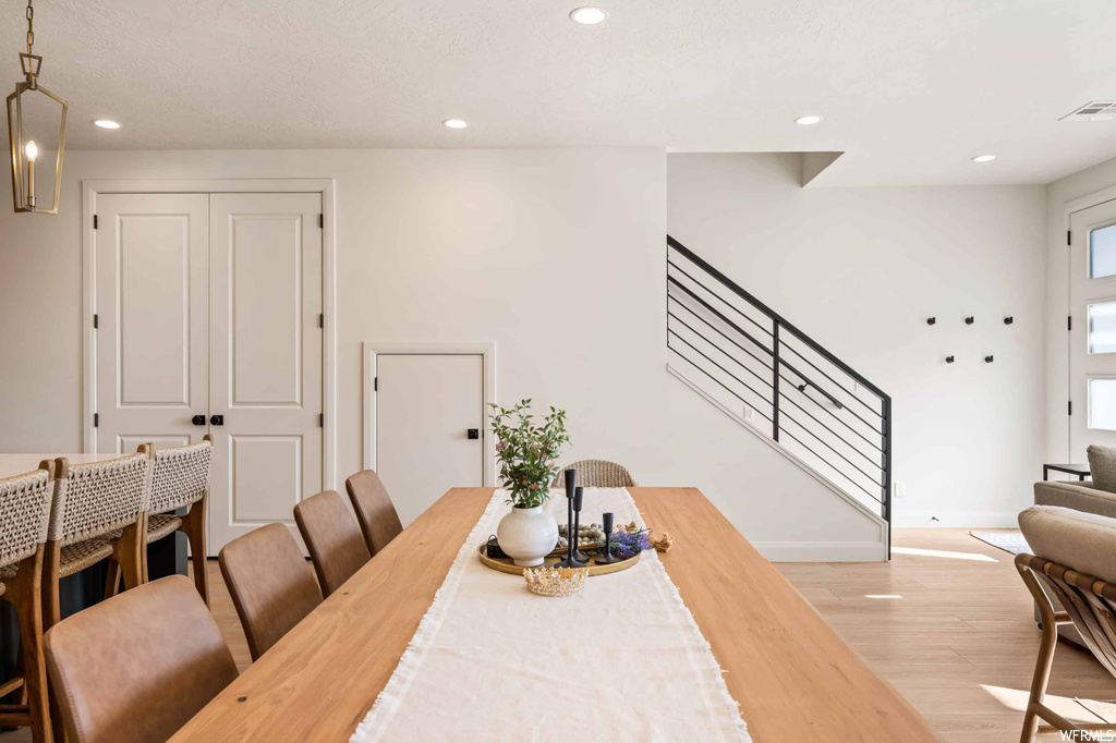 Dining space with light hardwood floors