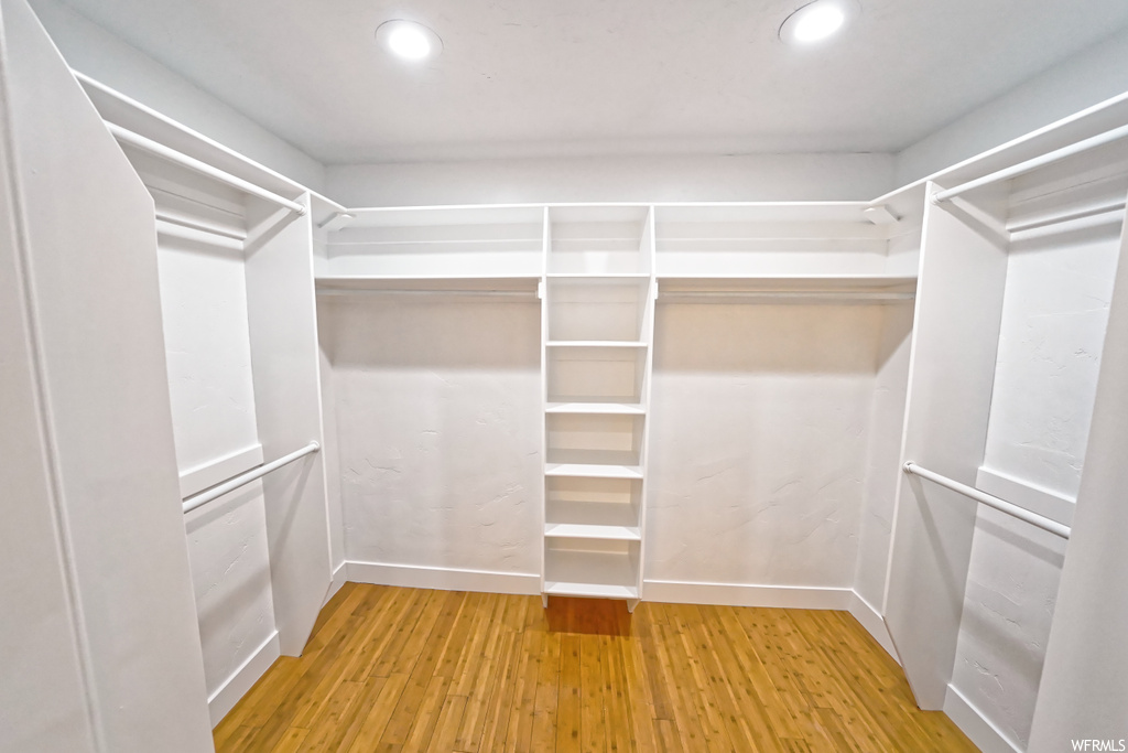 Walk in closet featuring light hardwood / wood-style floors