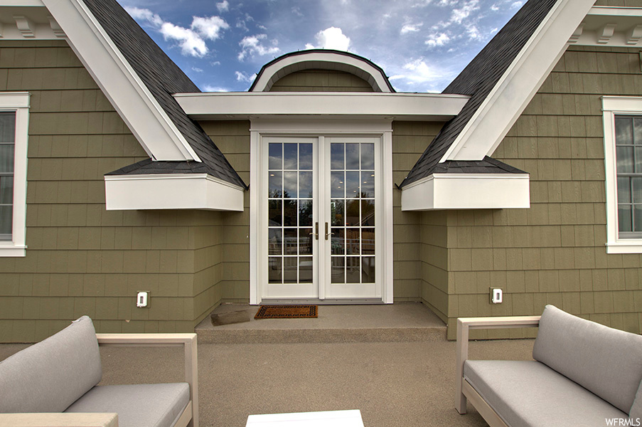 Exterior space with an outdoor living space and french doors