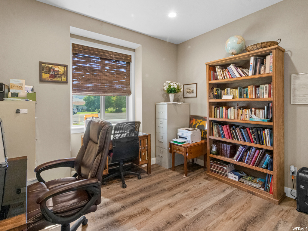 Home office featuring light hardwood flooring