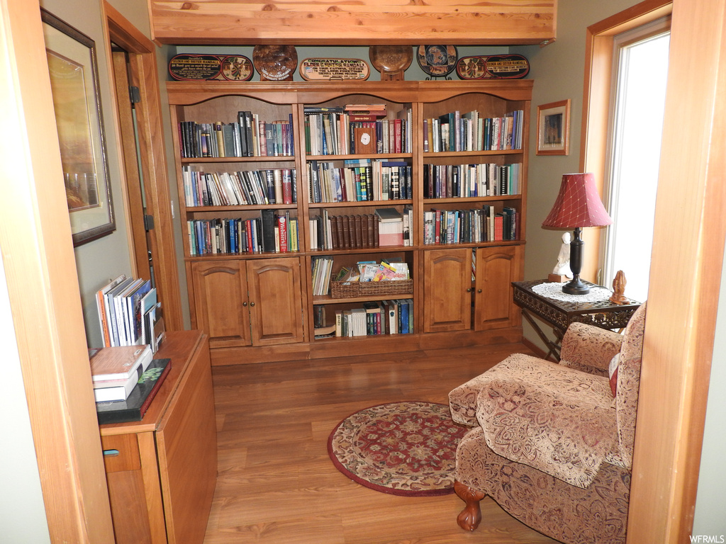 Living area with light hardwood flooring